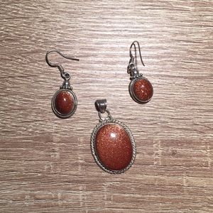 Sterling Silver set earrings and pendant goldstone